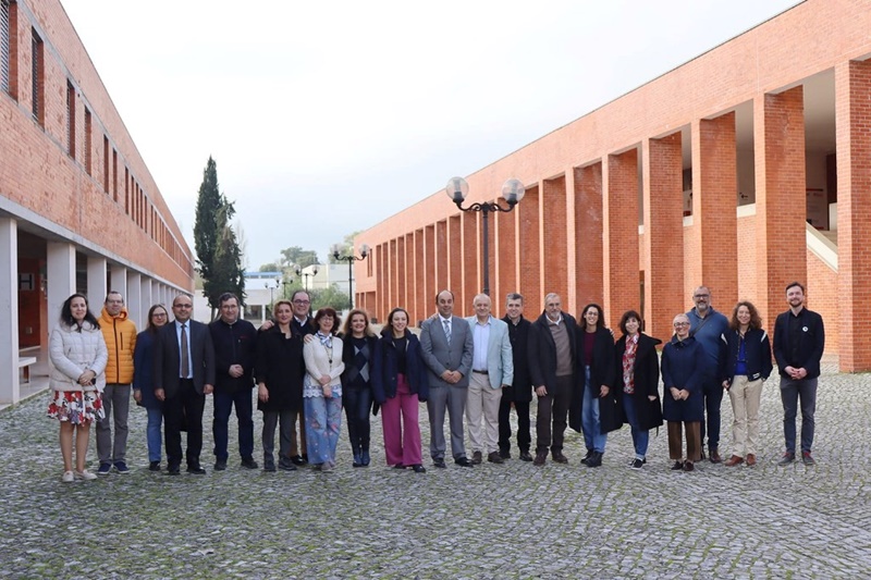 A group of people standing in front of a brick building AI-generated content may be incorrect.