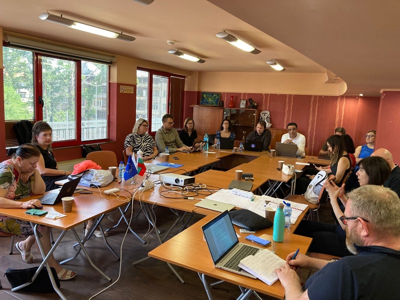 A group of people sitting at tables in a room