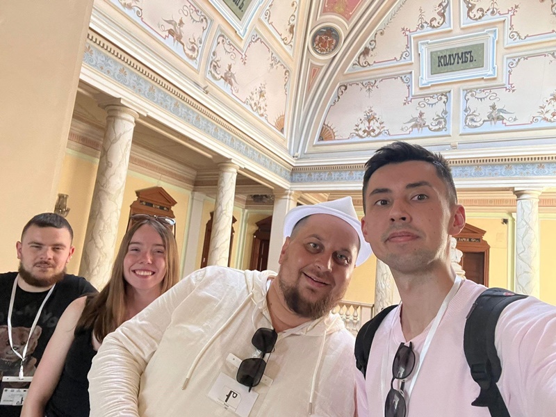 A group of people posing for a photo AI-generated content may be incorrect.