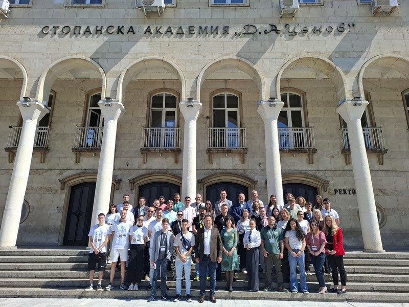 A group of people posing for a photo in front of a building AI-generated content may be incorrect.