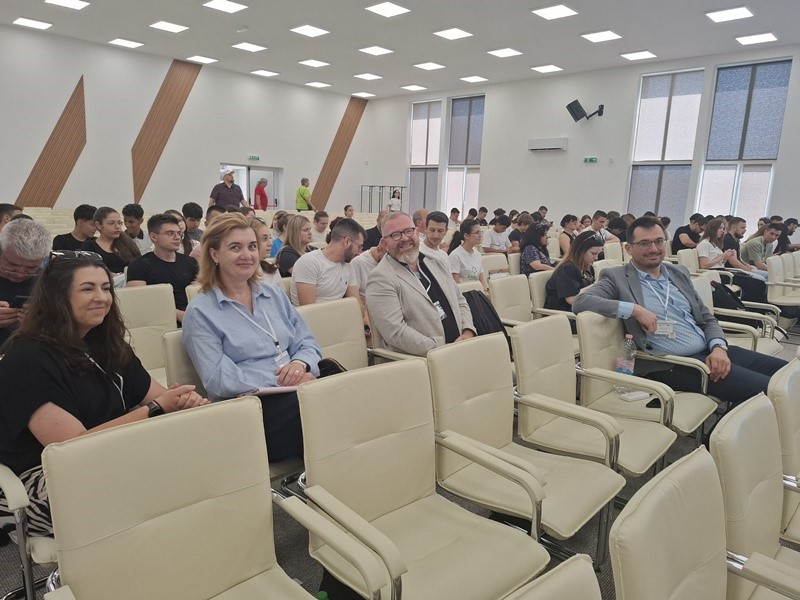 A group of people sitting in chairs AI-generated content may be incorrect.